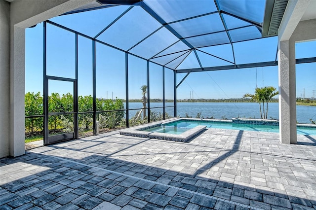 552 Bocelli Dr, North Venice, FL 34275 - view of swimming pool featuring a water view, a pool with connected hot tub, a lanai, and a patio area