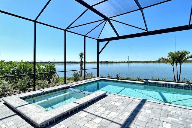 552 Bocelli Dr, North Venice, FL 34275 - view of pool featuring a patio area, glass enclosure, a pool with connected hot tub, and a water view