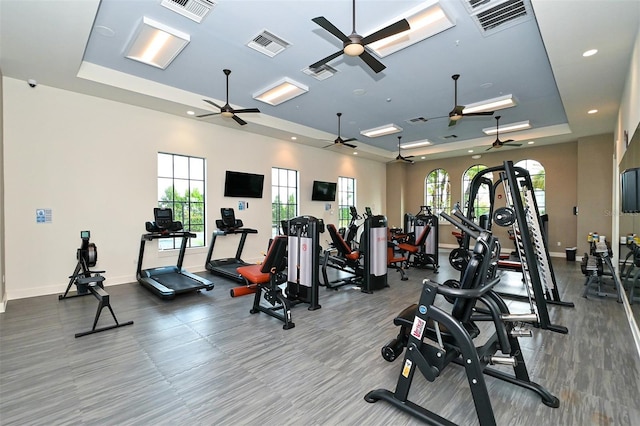 552 Bocelli Dr, North Venice, FL 34275 - gym with visible vents, a raised ceiling, and baseboards