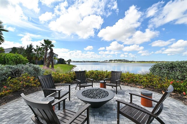 552 Bocelli Dr, North Venice, FL 34275 - view of patio featuring a fire pit and a water view