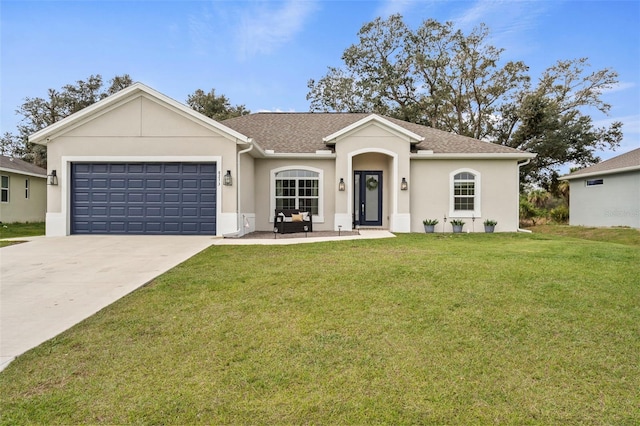 single story home featuring a garage and a front yard