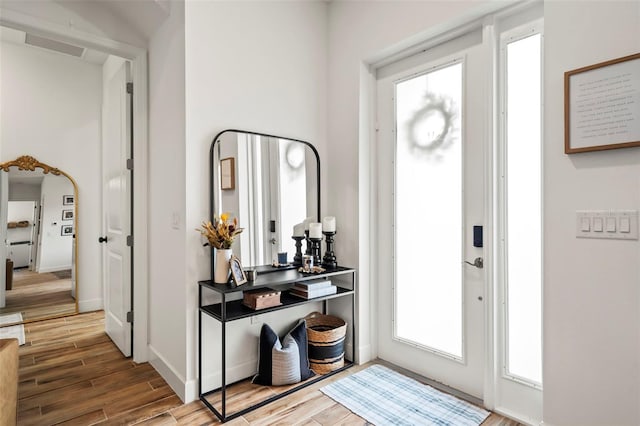 foyer featuring wood-type flooring