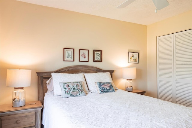 bedroom with ceiling fan and a closet