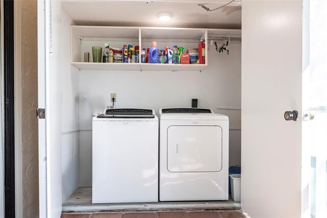 clothes washing area featuring independent washer and dryer