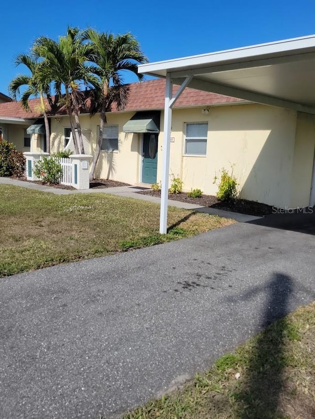 exterior space featuring a front lawn