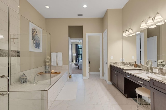 ensuite bathroom featuring visible vents, toilet, ensuite bathroom, marble finish floor, and a bath