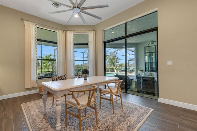 dining area featuring baseboards, visible vents, and dark wood-type flooring