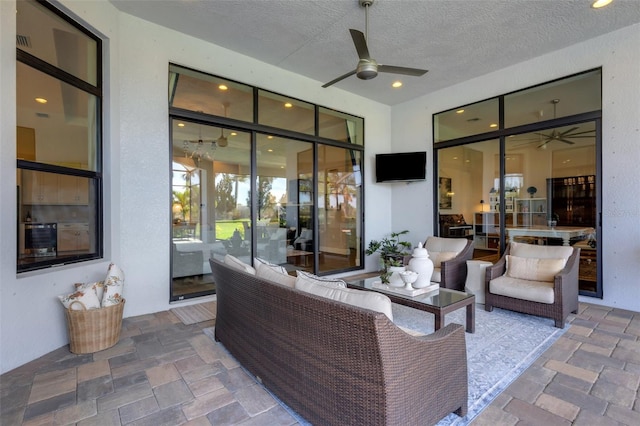 view of patio with ceiling fan and outdoor lounge area