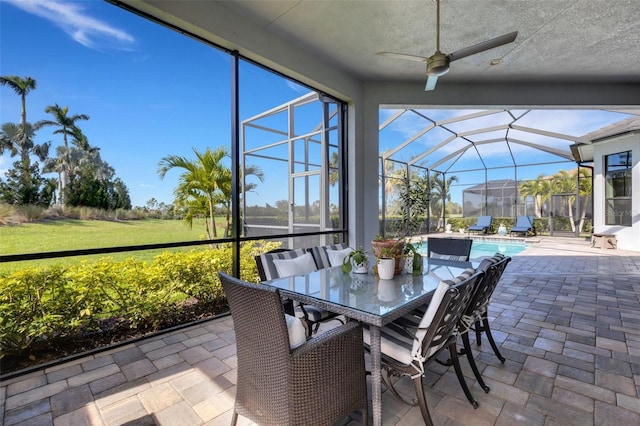 sunroom with a ceiling fan