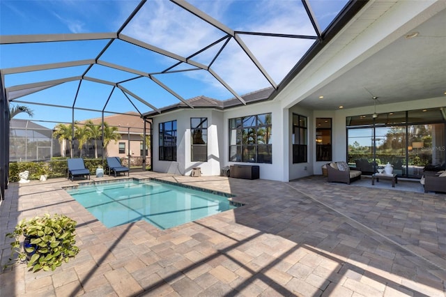 pool featuring an outdoor hangout area, a patio area, and a lanai