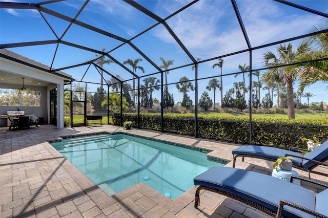 pool with a lanai and a patio area