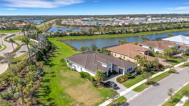 bird's eye view featuring a residential view and a water view