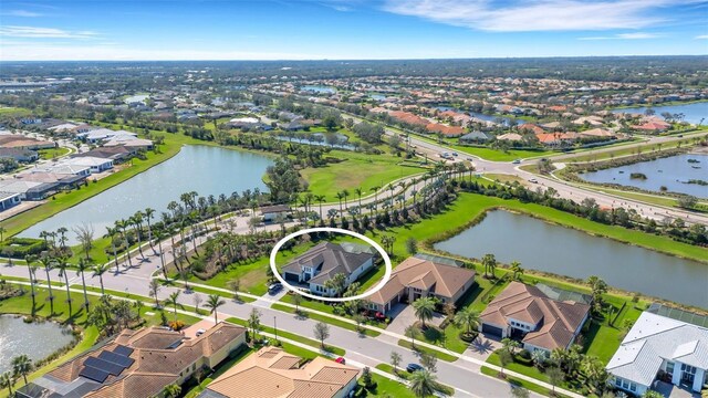 aerial view with a water view and a residential view