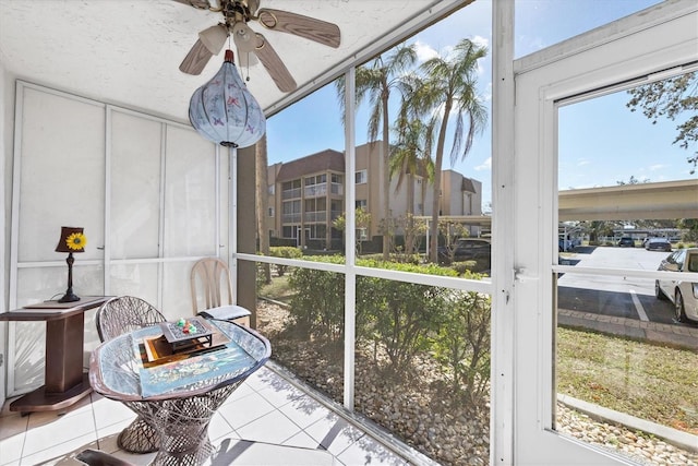 sunroom with plenty of natural light and ceiling fan