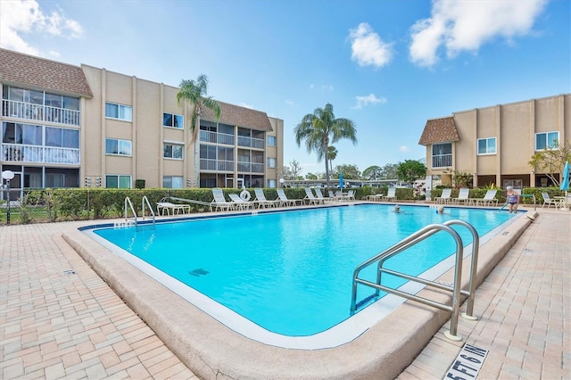 view of swimming pool featuring a patio