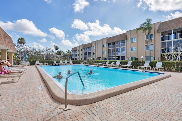 view of swimming pool featuring a patio