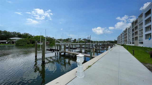 dock area with a water view and boat lift