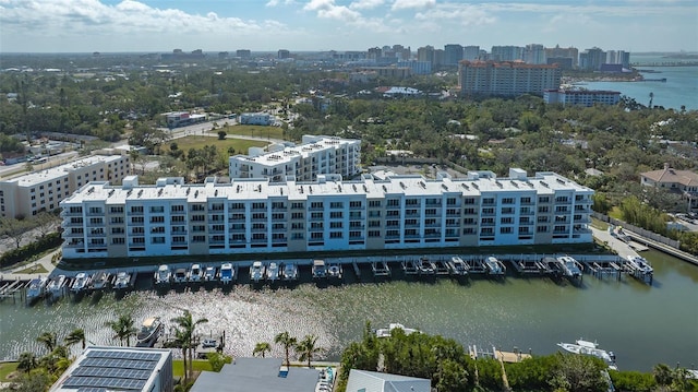 birds eye view of property with a view of city and a water view