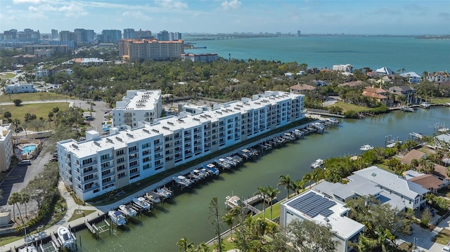 birds eye view of property with a view of city and a water view