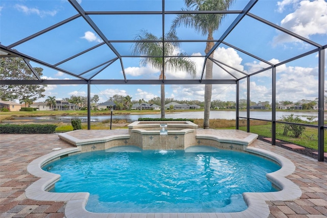 view of swimming pool with a patio, a water view, and glass enclosure