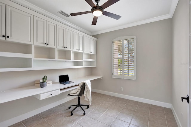 office space featuring light tile patterned floors, crown molding, built in desk, and ceiling fan