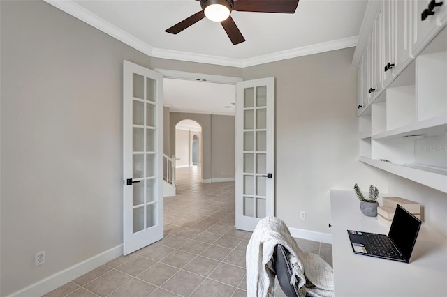 tiled home office with crown molding, french doors, and ceiling fan