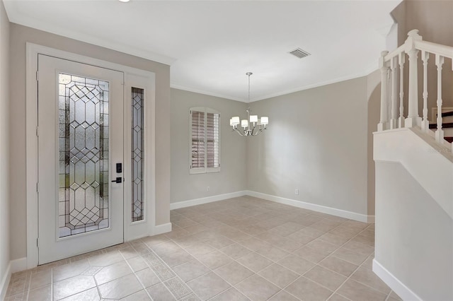 tiled foyer featuring a notable chandelier and crown molding