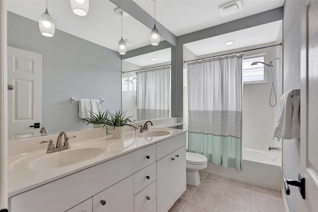 full bathroom with tile patterned flooring, shower / bath combo, vanity, and toilet