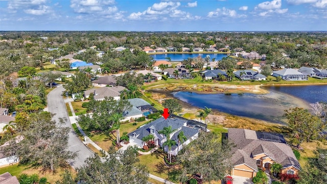 birds eye view of property featuring a water view