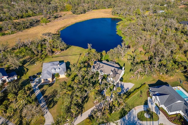 birds eye view of property with a water view