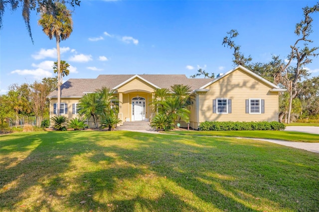 single story home featuring a front yard