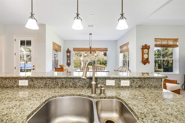 kitchen with sink and hanging light fixtures