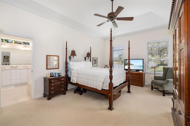 bedroom featuring crown molding, ensuite bath, ceiling fan, vaulted ceiling, and light colored carpet