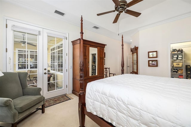 carpeted bedroom featuring ceiling fan, vaulted ceiling, ornamental molding, access to outside, and french doors