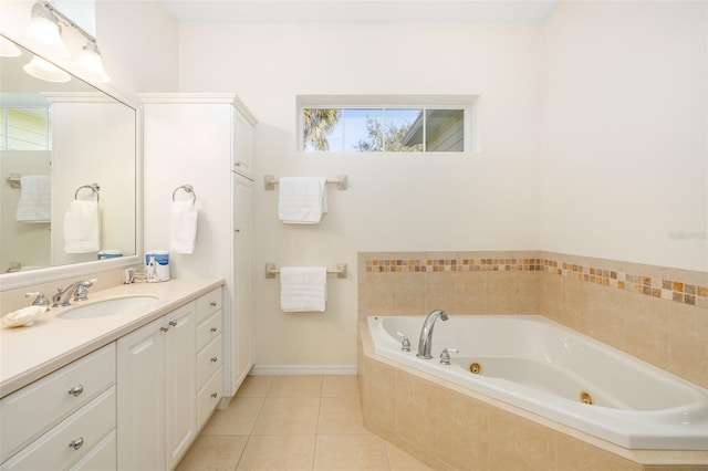 bathroom with tile patterned floors, tiled bath, and vanity