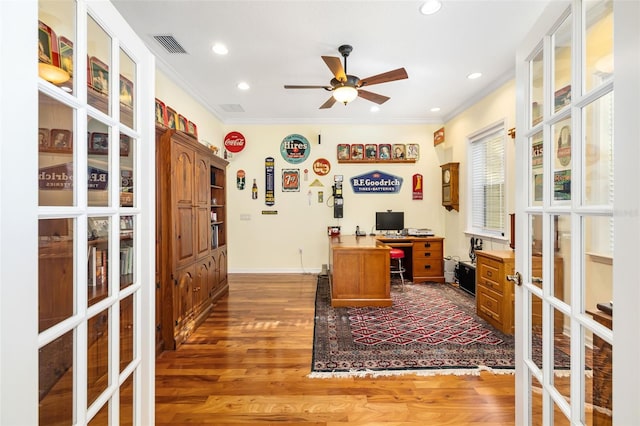 office area featuring french doors, ceiling fan, crown molding, and dark wood-type flooring