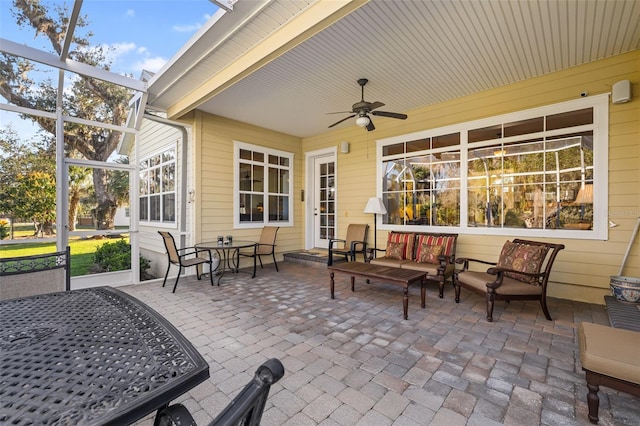 view of patio with outdoor lounge area and ceiling fan