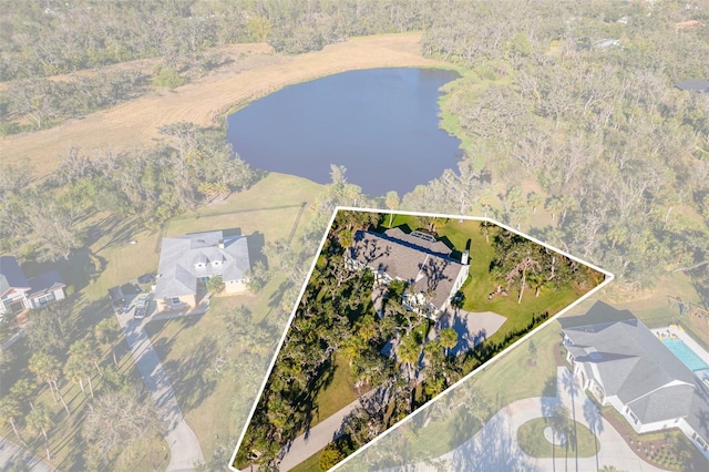 birds eye view of property with a water view