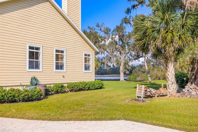 view of property exterior featuring a lawn