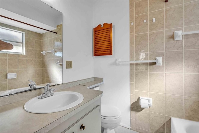 full bath featuring toilet and vanity