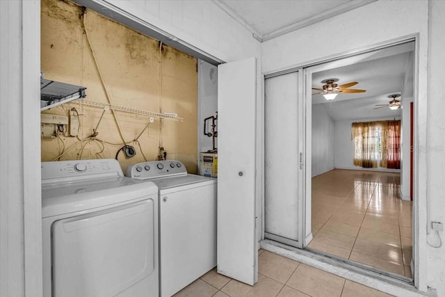 laundry room with washing machine and dryer, laundry area, and light tile patterned floors