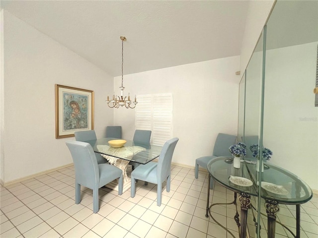 dining area with vaulted ceiling, a chandelier, and light tile patterned flooring