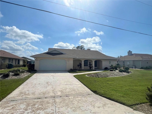 single story home featuring a garage and a front yard