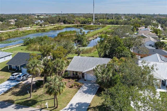 birds eye view of property featuring a residential view and a water view