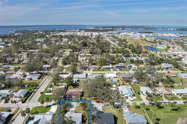 birds eye view of property with a residential view and a water view