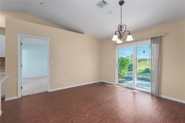 spare room featuring lofted ceiling, dark wood-style flooring, visible vents, baseboards, and an inviting chandelier