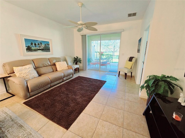 living room with light tile patterned floors, ceiling fan, and visible vents