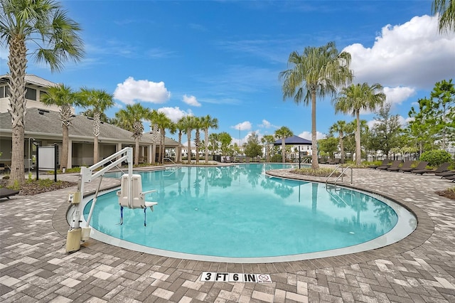 view of pool featuring a patio and a gazebo