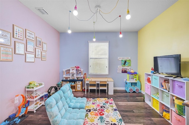 game room featuring dark wood-type flooring