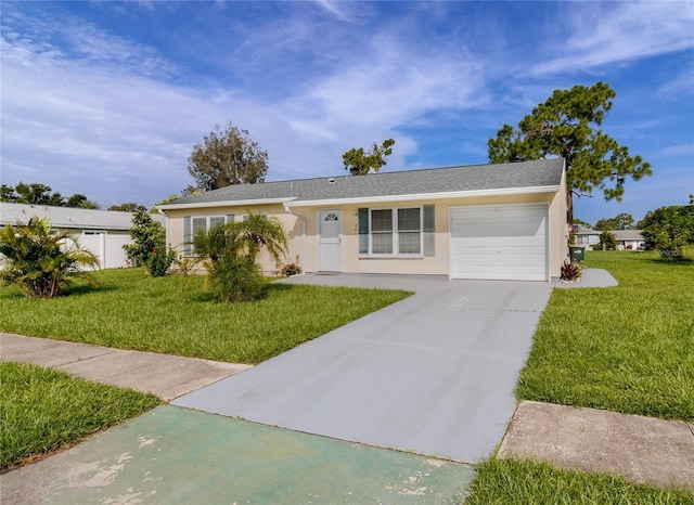 view of front of property featuring a garage and a front yard